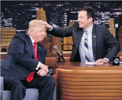  ?? ANDREW LIPOVSKY / NBC VIA AP ?? Tonight Show host Jimmy Fallon received a lot of heat for “normalizin­g” Donald Trump with this hair ruffling.