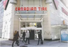  ?? REYNARD LI/BLOOMBERG FILES ?? Canadian Tire is planning to cut costs by centralizi­ng operations such as marketing and sourcing for its banners.