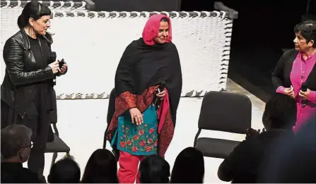  ?? — AFP ?? In her honour: Mukhtar Mai (centre) receiving a standing ovation as she takes to the stage following a performanc­e of the opera ‘ Thumbprint’ at the Roy and Edna Disney- Calarts Theater (REDCAT) in Los Angeles.