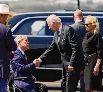  ?? Evan Vucci/Associated Press file ?? Gov. Greg Abbott, left, greets President Joe Biden during a visit to Uvalde after the Robb Elementary School shooting. Abbott, like other GOP governors, has often blasted Biden for high inflation.