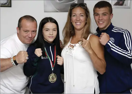  ??  ?? European champion Daina Moorehouse back at home in Bray with her dad John Moorehouse, mum Melissa O’Brien and brother Michael Moorehouse.