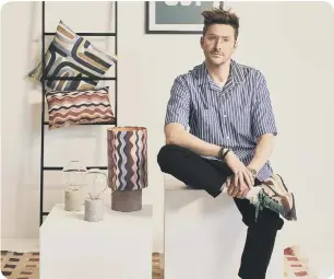  ?? ?? Henry Holland with homewares from his Modern Living Collection, Freemans, portrait. ● Henry Holland Modern Living for Freemans launches October 4.