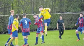  ??  ?? A Ferry Yellow U/19s player rises to head on in the league encounter with Dundee West at Downfield.