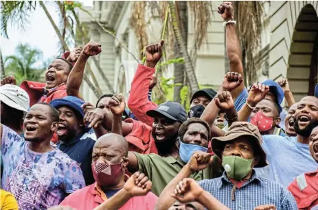  ?? /Darren Swart/Gallo Images ?? Social crisis: Shack dwellers in KwaZulu-Natal protest against the theft of hundreds of millions of Covid-19 funds. Unstoppabl­e township ‘service delivery’ revolts have made SA the protest capital.