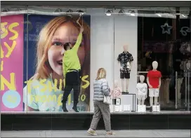  ?? YUI MOK — PA VIA AP ?? Final touches are made to a window display in a Primark store on Oxford Street, central London, on Sunday.