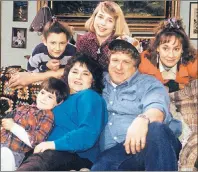  ?? AP PHOTO ?? The original cast of “Roseanne” will return to ABC two decades after it wrapped its hit series. In this undated image released by ABC, shows the cast members of “Roseanne,” Michael Fishman as DJ Conner, seated from left, Roseanne Barr as Roseanne Barr,...