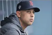  ?? David J. Phillip Associated Press ?? ALEX CORA was let go as Red Sox manager for his role in the Houston Astros’ sign-stealing scheme.