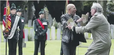  ??  ?? WHAT’S WITH THE SOLDIERS? As Vickers whisked the protester to the sidelines, he was watched with disinteres­t by a ceremonial guard composed of all branches of the defence forces of Ireland. The members of a ceremonial guard take pride in standing...