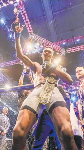  ?? Photo / Photosport ?? Israel “Stylebende­r” Adesanya is on top of the world after beating Robert Whittaker to become UFC middleweig­ht champion.