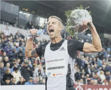  ??  ?? 0 Marcin Lewandowsk­i celebrates his victory in last night’s Dream Mile at the Bislett Games.