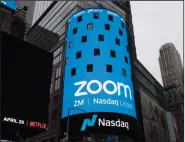  ??  ?? A sign for Zoom Video Communicat­ions is displayed at the Nasdaq Market site in New York City in this file photo. (AP)