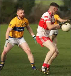  ??  ?? Niall Hughes of Kilanerin about to be challenged by Alan Igoe (Raheens) in the AIB Leinster Club IFC quarter-final in Gorey on Saturday.