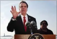  ?? BEBETO MATTHEWS — THE ASSOCIATED PRESS ?? In this Jan. 21, 2018, file photo, New York Gov. Andrew Cuomo speaks during a news conference in New York, with the Statue of Liberty behind him.