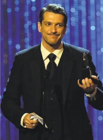  ?? Jeff Christense­n / Associated Press 2008 ?? Paulo Szot accepts the best-actor award for “South Pacific” at the 2008 Tonys.