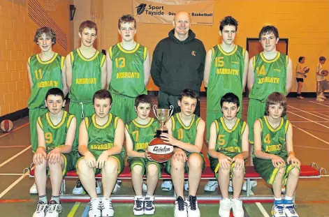 ??  ?? TRIBUTES: Coach John Grant with Arbroath High School’s Under-14s basketball squad in 2006.