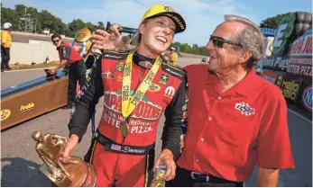  ?? MARK J. REBILAS, USA TODAY SPORTS ?? Leah Pritchett, left, with team owner Don Schumacher, is third in points in the NHRA’s Top Fuel division and has four wins.