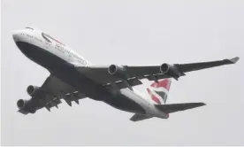  ??  ?? One of the 747s performs a flypast over Heathrow on its final flight. Photograph: Toby Melville/Reuters