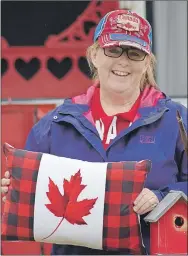  ?? ASHLEY THOMPSON ?? Berwick resident Cheryl Fancey poses with the display she created as part of the town-wide Red Chair Challenge for July 1, a date that has a special place in her heart for a couple of reasons.