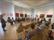  ?? ?? A panel of 14 artists sit before a crows on Sunday at the Museum of Northern California Art in Chico.