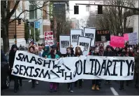  ?? AP PHOTO ?? People march in support of female empowermen­t and women’s rights Saturday in Portland, Ore.