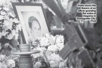  ?? ?? Photo shows the firearm of an officer guarding the wake of Degamo in Dumaguete City. PTV4