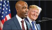  ?? CURTIS COMPTON/AJC 2019 ?? Then-president Donald Trump looks on as business owner Kelvin King joins him on stage to speak during the Black Voices for Trump Coalition Rollout in Atlanta in November 2019.