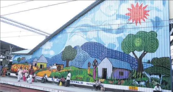  ??  ?? MADURAI: This painting on an escalator wall by artist A Kannan depicts a scene from rural Tamil Nadu, and helped win Madurai a spot in second place. The soothing blues and expansive view became instantly popular with passengers. The station also...