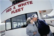  ?? Sarah Rice / Special to The Chronicle ?? Larry Richardson gives wife Barbara a kiss as they come into view of the Golden Gate Bridge in person.