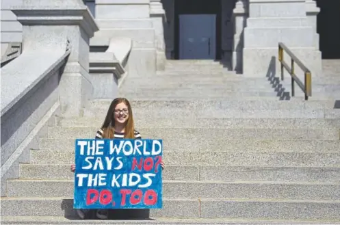  ?? Joe Amon, The Denver Post ?? Isabella Yow 16, a sophomore at Cherry Creek High School, sits on the steps of the Colorado Capitol during Wednesday’s nationwide walkout to protest gun violence.