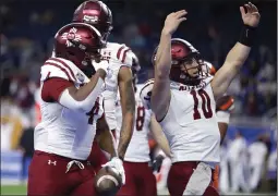  ?? AL GOLDIS — THE ASSOCIATED PRESS ?? New Mexico State running back Star Thomas, left, and quarterbac­k Diego Pavia (10) celebrate after Thomas’ TD catch against Bowling Green in the Quick Lane Bowl.