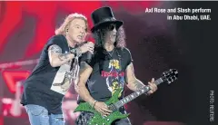  ??  ?? Axl Rose and Slash perform in Abu Dhabi, UAE.