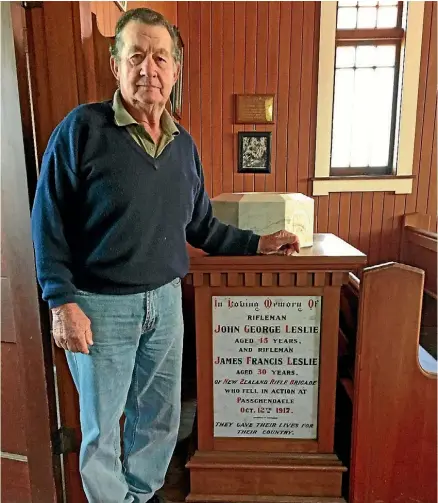  ??  ?? Descendant Graham Leslie stands beside the Leslie brothers’ memorial plaque inside the All Saints Church in Kaeo.