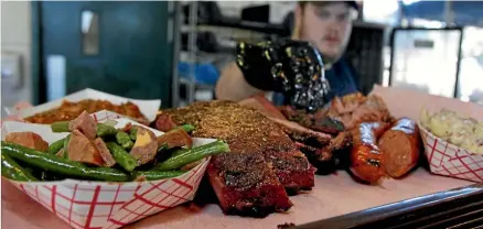  ?? PHOTO: REUTERS ?? You can’t go wrong with a bite of Southern-style barbecued meat.