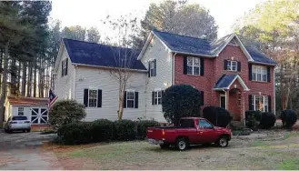  ?? Jeffrey S. Collins / Associated Press ?? Cars are parked Tuesday at a home in York, S.C., where multiple deputies responding to a domestic violence call were shot and wounded. Police said the suspect, Christian Thomas McCall, also was shot.