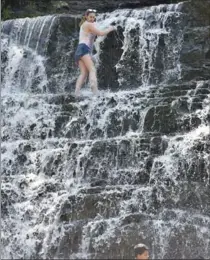  ?? HAMILTON SPECTATOR FILE PHOTO ?? People play in the water at Albion Falls, but should they? Water is not tested because it’s not a designated public swimming area.