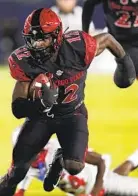  ?? ASHLEY LANDIS AP ?? Aztecs cornerback­s Noah Avinger (left) and Dallas Branch (right) each had offseason surgery to repair dislocated left shoulders almost immediatel­y after playing in bowl.