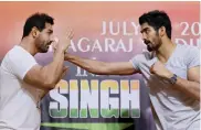  ??  ?? Actor John Abraham and boxer Vijender Singh at a promotiona­l event in Mumbai on Wednesday.