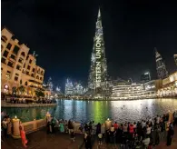  ?? Photo by M. Sajjad ?? The Burj Khalifa adorned in yellow and black, celebratin­g the legacy of western Union, on sunday. —