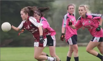  ??  ?? Rachael Bridges (St. Martin’s) pursued by Aoife Tormey and Leanne Brennan of Clonard/Volunteers.