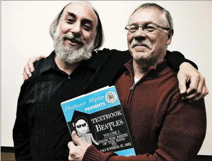  ?? GREGORY ALEXANDER PHOTO ?? Gregory Alexander, left, aka Professor Moptop onWXRT’s “Breakfast with the Beatles” show, has published the first of what he hopes will be a series of textbooks on the band. He’s standing with Dan Byrne, a retired District 218 teacher who inspired him to write a book.