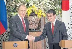  ?? REUTERS ?? Russian Foreign Minister Sergey Lavrov shakes hands with Japanese Foreign Minister Taro Kono after a news conferenc at Iikura Guest House in Tokyo yesterday.