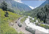  ?? REUTERS ?? An Indian Army convoy moves along a highway leading to Ladakh, n at Gagangeer in Kashmir's Ganderbal district.