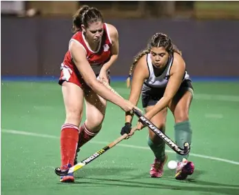  ?? PHOTO: NEV MADSEN ?? BATTLE FOR THE BALL: Red Lion’s representa­tive player Ainsley Clanchy competes for the ball with Amber Mutch from Norths at Clyde Park.