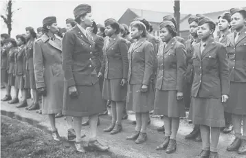  ?? U.S. ARMY WOMEN’S MUSEUM ?? Members of the all-female Black 6888th battalion stand in formation in 1945 in Birmingham, England. Lawmakers are reviving an effort to pay the families of Black WWII veterans for benefits they were denied .