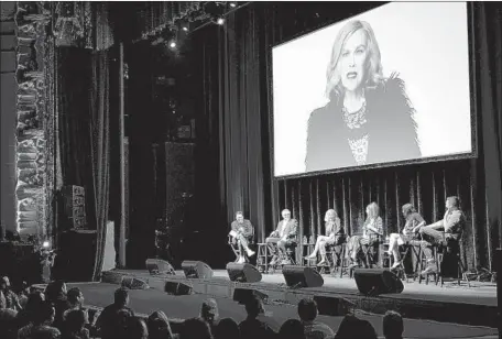  ?? Photograph­s by Patrick T. Fallon For The Times ?? CATHERINE O’HARA is on screen as character Moira Rose during a panel with her fellow “Schitt’s Creek” cast members Sunday.