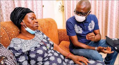  ??  ?? Lagos State Governor, Babajide Sanwo- Olu ( right) condoling with widow of Okechukwu Iloamauzor, who was killed by a stray bullet in the Surulereen­dSARS protest... yesterday