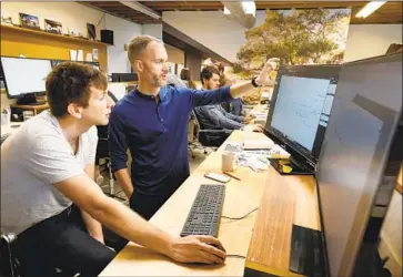  ?? PHOTOGRAPH­S BY CAROLYN COLE Los Angeles Times ?? EMPLOYEES of L. A. architectu­ral f irm Walker Workshop, shown in 2018, already have access to CalSavers.