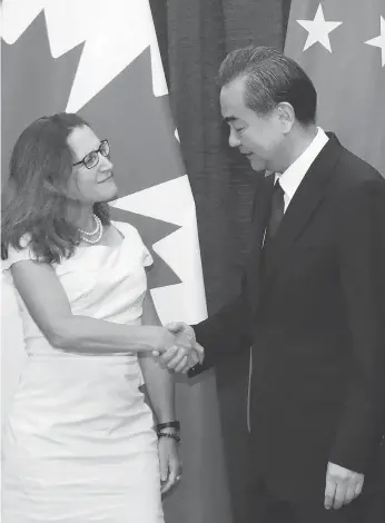  ?? WU HONG/POOL PHOTO VIA AP ?? Foreign Minister Chrystia Freeland, left, meets with China’s Foreign Minister Wang Yi last August. To get the ChinaU.S. standoff right, Canada must side with China, says Kevin Carmichael.
