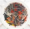  ??  ?? Containers at Harm Reduction Action Center in Denver are filled with used syringes.