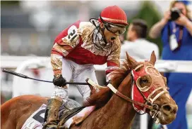  ?? SILAS WALKER / LEXINGTON HERALD-LEADER ?? Stewards last week suspended Sonny Leon, jockey for Rich Strike, for careless riding in the third race on April 27 at Thistledow­n Racecourse.